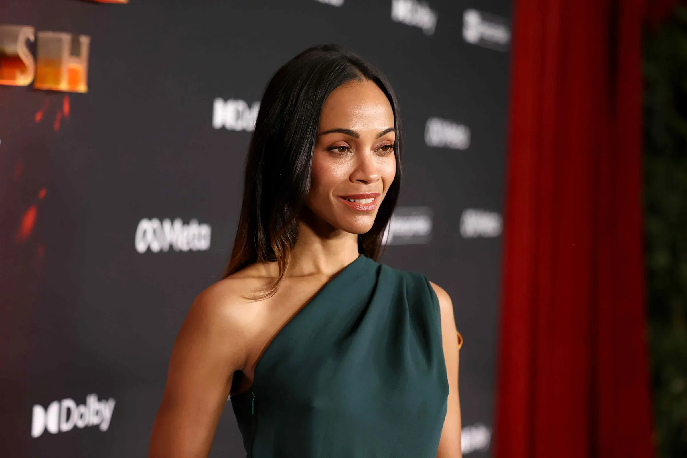 Zoe Saldaña Stuns in a Gravity-Defying, Plunging Leather Top