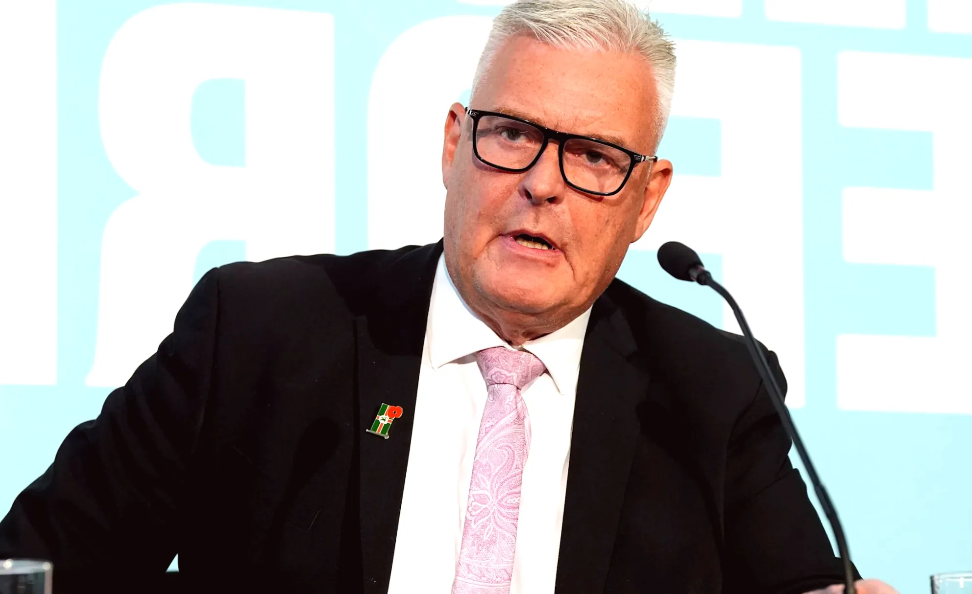 School issues apology for placing MP's photo near fascists