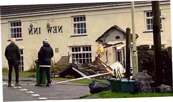 Bulldozer crashes into village pub during opening hours