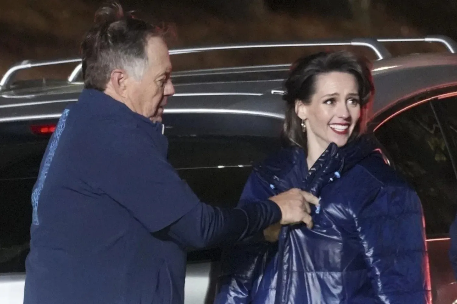 Bill Belichick Protects Girlfriend Jordon Hudson with His Coat from Sheer Outfit
