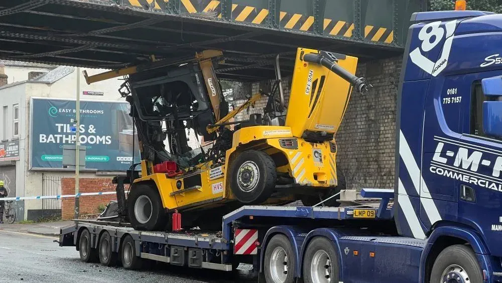 Truck trapped under bridge leading to road closures