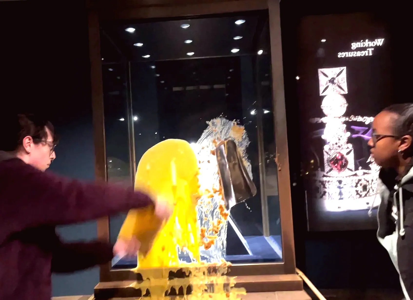 4 Individuals Detained for Allegedly Hurling Desserts at England's Crown Jewels: Watch the Footage