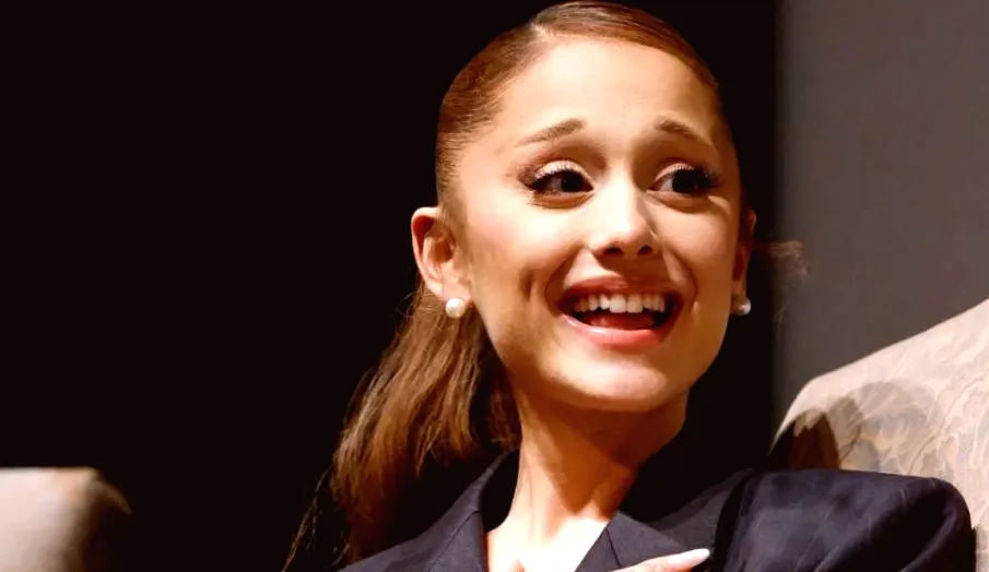 Ariana Grande transforms into Naomi Campbell wearing Givenchy Suit & Bra