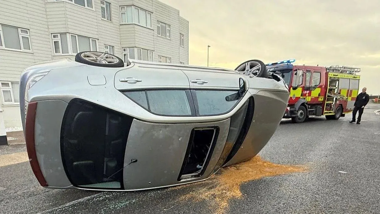 Car overturns near the waterfront during busy traffic hours