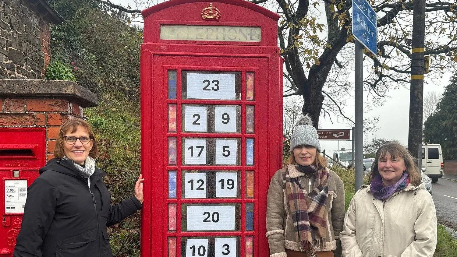 Village converts phone booth into advent calendar