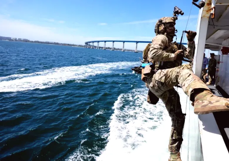 Coast Guard awaiting specialized teams in tanker standoff, according to Reuters