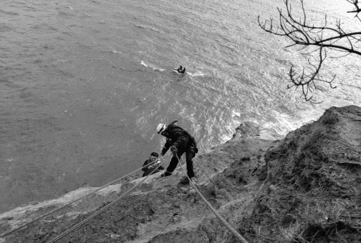 Firefighters come to the rescue of stranded surfer at cliff base