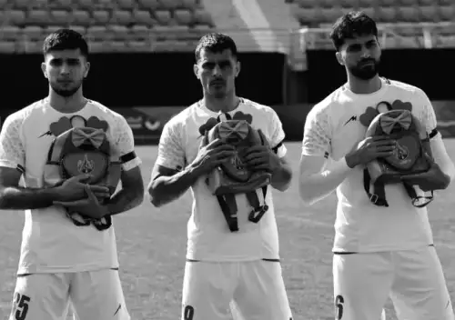 Iranian Soccer Players Show Solidarity with Slain Girls by Holding Schoolbags