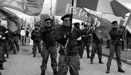 Large crowd assembles for dissident republican Easter march.