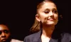 Ariana Grande emulates Naomi Campbell in sleek suit and bra
