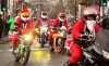 Hundreds of Santas participate in a charity bike ride for children's hospice