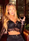 Model Hannah Palmer Looks Stunning While Sipping Wine in Seductive Lace Crop Top