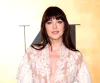 Dakota Johnson's White Lace Gown with Plunging Neckline and Y2K Detail Divides Opinion