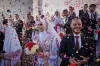 Photos of Palestinian couples celebrating a large wedding in Gaza during a fragile ceasefire.